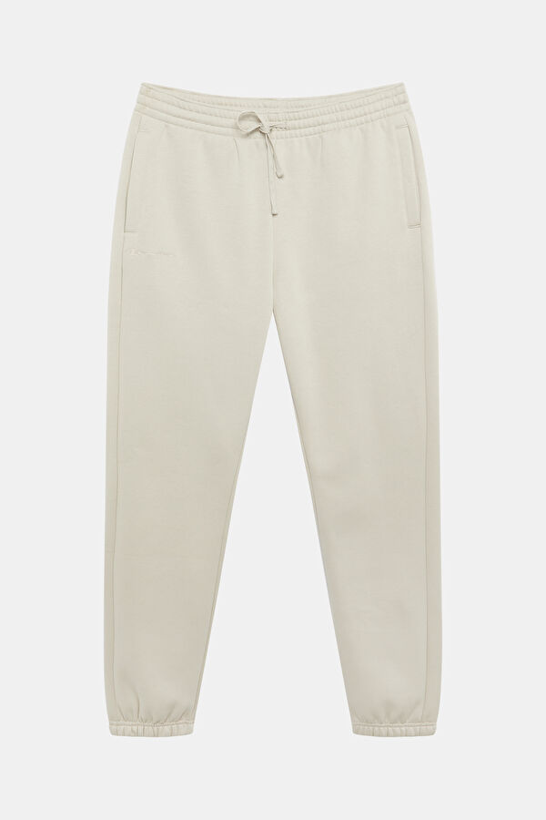 Cream-colored, straight-leg sports pants for men.