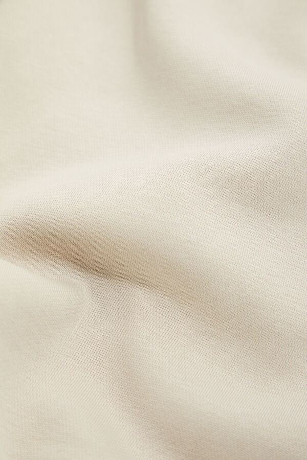 Cream-colored, straight-leg sports pants for men. 5